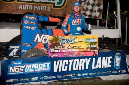 Tyler Courtney celebrates his victory in the USAC NOS Energy Drink National Midget opener Friday night at Bubba Raceway Park in Ocala, Fla. (USAC Photo)