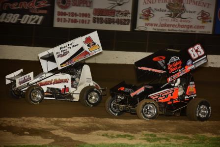 Hunter Schuerenberg (G1) and Lynton Jeffrey (83) battle at Lake Ozark Speedway (Mark Funderburk Photo)