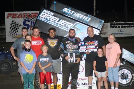 Kaley Gharst celebrates his Sprint Invaders win Friday at Lee County Speedway (D&M Photography)