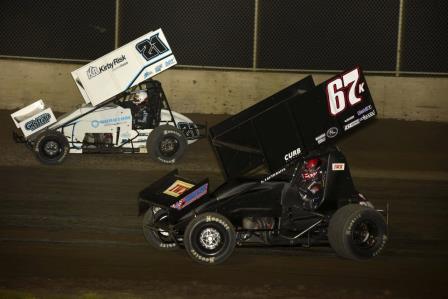 Brinton Marvel (21) and Daison Pursley (67) battle in Friday MOWA action at Tri-City Speedway (Mark Funderburk Racing Photo)