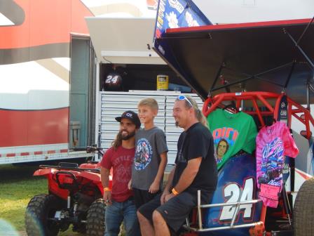 Rico Abreu and Jason Sides visit with a young fan