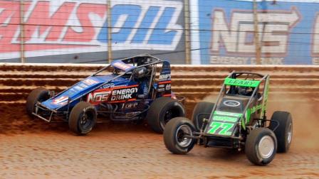 Eventual winner C.J. Leary (#77m) and Justin Grant (#4) battle for the lead during Saturday's USAC AMSOIL National Sprint Car feature at BAPS Motor Speedway. (Lee Greenawalt Photo) (Video Highlights from FloRacing.com)