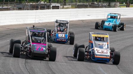 Winner Kody Swanson (#77) battles Bobby Santos (#22) for the lead in Saturday's Carb Night Classic USAC Silver Crown opener at Lucas Oil Raceway in Brownsburg, Ind. (Dave Olson Photo) (Video Highlights from FloRacing.com)