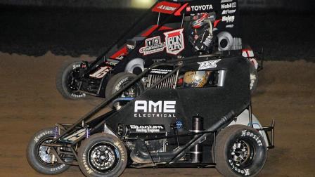 Eventual winner Tanner Thorson (#19T) and Emerson Axsom (#15) race side-by-side for the lead late in Thursday night's Chad McDaniel Memorial USAC NOS Energy Drink National Midget feature at Solomon Valley Raceway. (Lonnie Wheatley Photo) (Video Highlights from FloRacing.com)