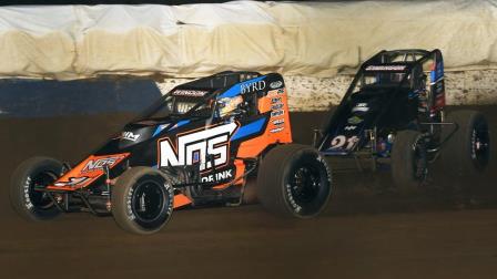Eventual winner Chris Windom (#19) slides past Jake Swanson (#21AZ) for the lead with 13 laps remaining in Friday night's Jim Hurtubise Classic at the Terre Haute (Ind.) Action Track. (David Nearpass Photo) (Video Highlights from FloRacing.com)