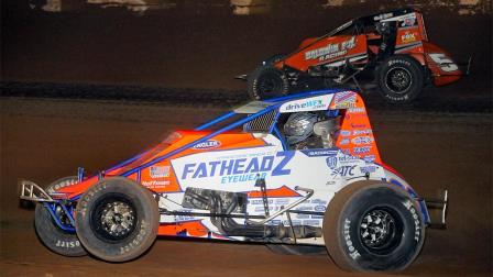 Eventual winner Brady Bacon (#69) battles with Logan Seavey (#5) for the lead during the late stages of Friday night's Western World Championship opener for the USAC AMSOIL Sprint Car National Championship. (Lonnie Wheatley Photo) (Video Highlights from FloRacing.com)