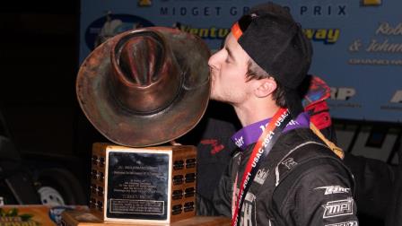 Logan Seavey (Sutter, Calif.) kisses the Turkey Night Grand Prix trophy after capturing Saturday's USAC NOS Energy Drink Midget National Championship season finale at California's Ventura Raceway. (Devin Mayo Photo) (Video Highlights from FloRacing.com)