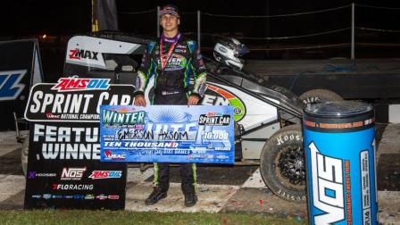 Emerson Axsom (Franklin, Ind.) proudly displays the $10,000 check for winning Saturday night's USAC AMSOIL Sprint Car National Championship feature at Ocala, Florida's Bubba Raceway Park, the finale of Winter Dirt Games XIII. (Rich Forman Photo) (Video Highlights from FloRacing.com)