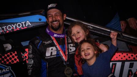 Thomas Meseraull (San Jose, Calif.) is all smiles as he enjoys victory lane with his daughters following Friday's Shamrock Classic night one victory at the Southern Illinois Center in Du Quoin. (Jack Reitz Photo) (Video Highlights from FloRacing.com)