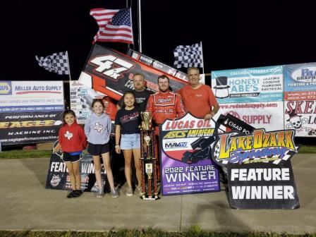 Dylan Westbrook passed Matt Covington late to win the ASCS feature at Lake Ozark Saturday (Rob Kocak Photo)