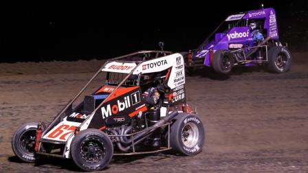 Buddy Kofoid (#67) slides Kaylee Bryson (#71) for the lead and the win during Thursday night's USAC NOS Energy Drink Midget National Championship feature at Indiana's Gas City I-69 Speedway. (Josh James Photo) (Video Highlights from FloRacing.com)