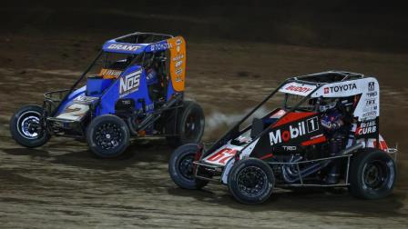 Winner Justin Grant (#2J) tussles with Buddy Kofoid (#67) during the waning laps of Saturday night's Harvest Cup USAC NOS Energy Drink Midget National Championship feature at Haubstadt, Indiana's Tri-State Speedway. (Josh James Artwork Photo) (Video Highlights from FloRacing.com)