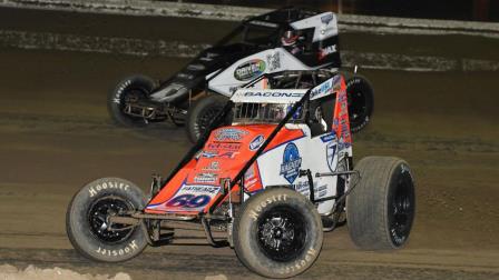 Brady Bacon (#69) passes Emerson Axsom (#47BC) for the lead and the win during Thursday night's USAC AMSOIL Sprint Car National Championship season opener at Florida's Bubba Raceway Park. (Chad Warner Photo) (Video Highlights from FloRacing.com)