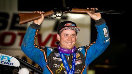 Brady Bacon (Broken Arrow, Okla.) holds the traditional Tony Hulman Classic winner's rifle in the air following his USAC AMSOIL Sprint Car National Championship feature victory on Tuesday night at the Terre Haute (Ind.) Action Track. (Indy Racing Images Photo) (Video Highlights from FloRacing.com)