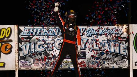 Logan Seavey (Sutter, Calif.) performs a cage stand following his USAC NOS Energy Drink Midget National Championship victory on Friday night at Fairbury, Nebraska's Jefferson County Speedway. (Rich Forman Photo) (Video Highlights from FloRacing.com)