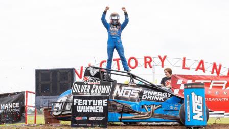 Justin Grant performs a cage stand after winning Saturday's Ted Horn 100 USAC Silver Crown race at the Du Quoin State Fairgrounds in southern Illinois. (Rich Forman Photo) (Video Highlights from FloRacing.com)