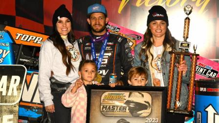 Justin Grant celebrates a $20,000 Fall Nationals victory on Saturday night at Lawrenceburg (Ind.) Speedway with wife Ashley Grant (left), sister-in-law Emily Jones (right) and Justin's children (bottom). (David Nearpass Photo) (Video Highlights from FloRacing.com)