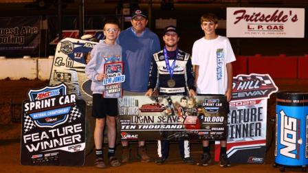 Winner Logan Seavey is joined by Levi Jones and Levi's two sons after Seavey's victory in Friday's Salute to Levi Jones at Red Hill Raceway. (Rich Forman Photo) (Video Highlights from FloRacing.com)