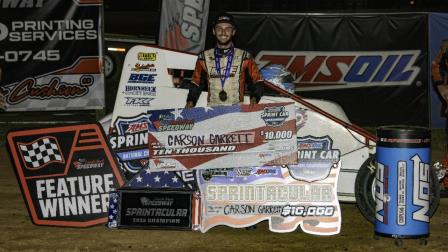 Carson Garrett holds the $10,000 check after winning his first career USAC AMSOIL Sprint Car National Championship feature following Saturday night's Sprintacular at Putnamville, Indiana's Honest Abe Roofing Lincoln Park Speedway. (Ryan Sellers Photo) (Video Highlights from FloRacing.com)