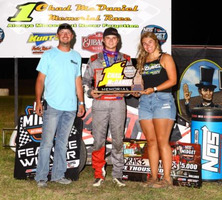 Winner Drake Edwards (middle) is joined by Chad McDaniel's son and daughter in victory lane after Edwards' won Wednesday night's Chad McDaniel Memorial at the Mitchell County Fairgrounds Raceway in Beloit, Kansas. (Rich Forman Photo) (Video Highlights from FloRacing.com)