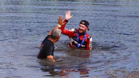 Driver C.J. Leary and team owner Mike Burkhart took the plunge into the infield lake after winning Saturday's Ted Horn 100 USAC Silver Crown race at the Du Quoin State Fairgrounds in southern Illinois. (Rich Forman Photo) (Video Highlights from FloRacing.com)