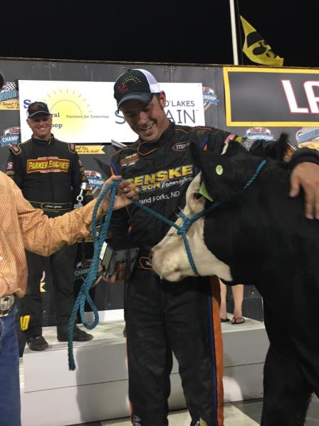 Mark Dobmeier looks over a future steak dinner after winning Saturday at Knoxville (Knoxville Raceway Photo)