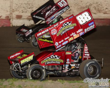 TMAC drives inside Tim Kaeding at Tulare (Chucko’s Photos – www.ChuckO.com/Photo)