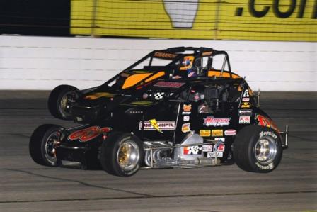 Kody Swanson (in black) battles with brother Tanner Swanson on his way to his third-straight USAC Silver Crown victory in Friday night's "Dave Steele Carb Night Classic" at Lucas Oil Raceway at Indianapolis (David Nearpass Photo)