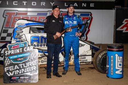 Exactly four years to the day of his first career USAC AMSOIL National Sprint Car start at Indiana's Terre Haute Action Track, Mitchel Moles (right) earned his first career Terre Haute victory during Wednesday's 56th Annual Tony Hulman Classic. Grand marshal and 1996 Hulman Classic winner Doug Kalitta (left) presented Moles the rifle in victory lane. (Indy Racing Images Photo) (Video Highlights from FloRacing.com)