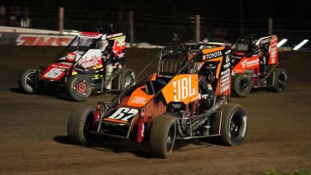 Winner Jacob Denney (#67) battles Cale Coons (#85) and Jakeb Boxell (#54) during Friday night's USAC NOS Energy Drink Midget National Championship feature at Fairbury, Nebraska's Jefferson County Speedway. (Ray Hague Photo) (Video Highlights from FloRacing.com)