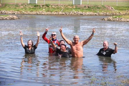 Winner C.J. Leary & the Team AZ / Petty-Rossi / Curb-Agajanian Racing crew celebrate Saturday's Ted Horn 100 USAC Silver Crown victory by taking a dive into the infield pond at the Du Quoin State Fairgrounds in southern Illinois. (Rich Forman Photo) (Video Highlights from FloRacing.com)